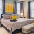 Large bedroom with windows on two walls providing plenty of natural light.